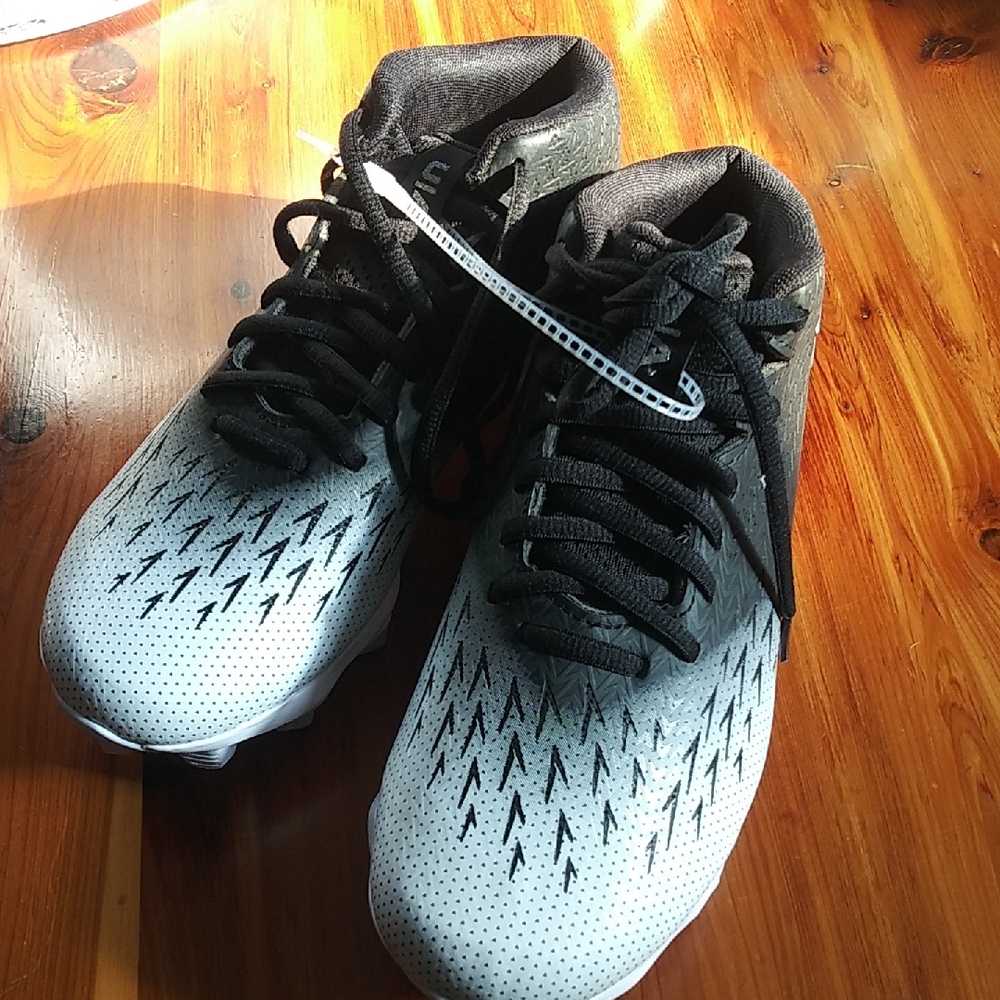 Under Armour Black and White kids cleats with Textured Upper, new